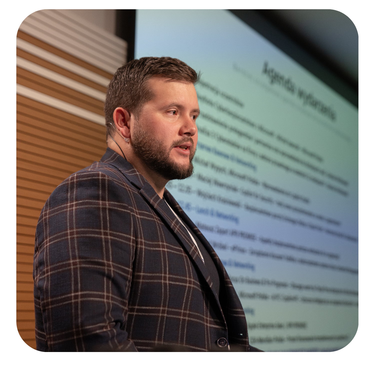 Speaker presenting a slide on cybersecurity during a talk